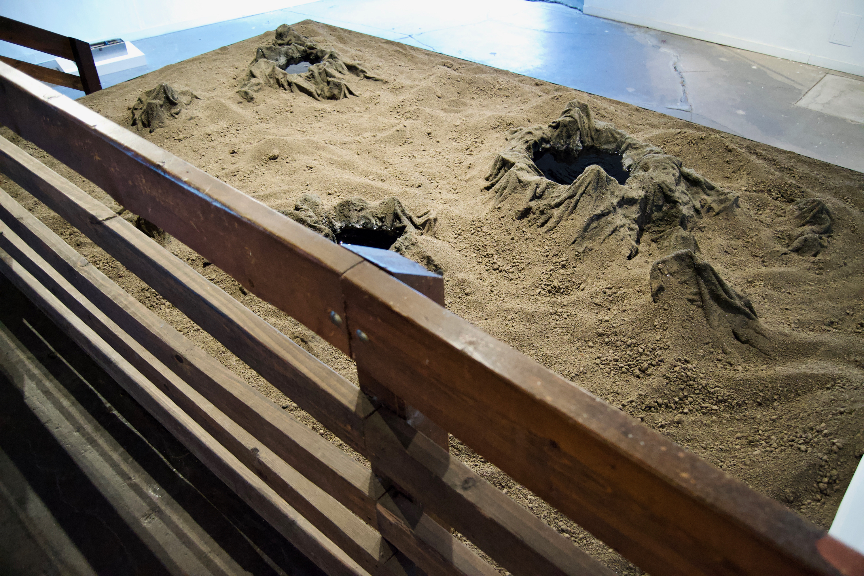 Caroline Hatfield, Land and Water, 2019, 45" x 144" x 96”, mortar stands, plywood, crushed recycled concrete, resin bonded concrete, aluminum, water, water pumps