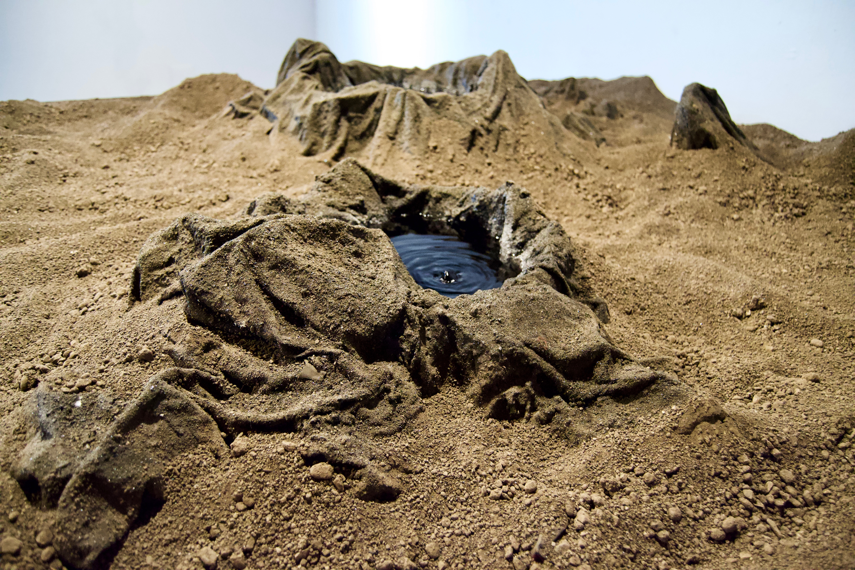 Caroline Hatfield, Land and Water, 2019, 45" x 144" x 96”, mortar stands, plywood, crushed recycled concrete, resin bonded concrete, aluminum, water, water pumps