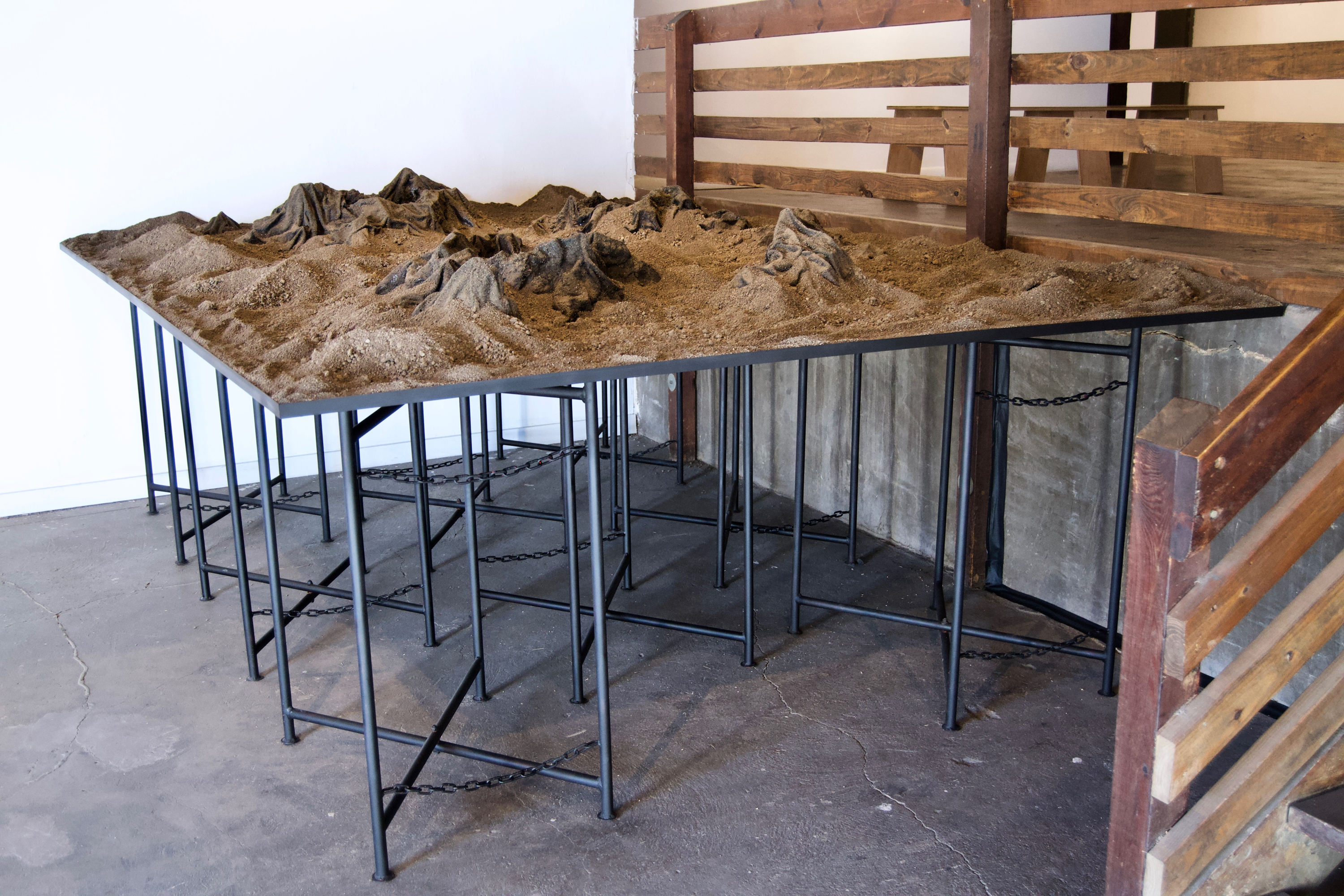 Caroline Hatfield, Land and Water, 2019, 45" x 144" x 96”, mortar stands, plywood, crushed recycled concrete, resin bonded concrete, aluminum, water, water pumps