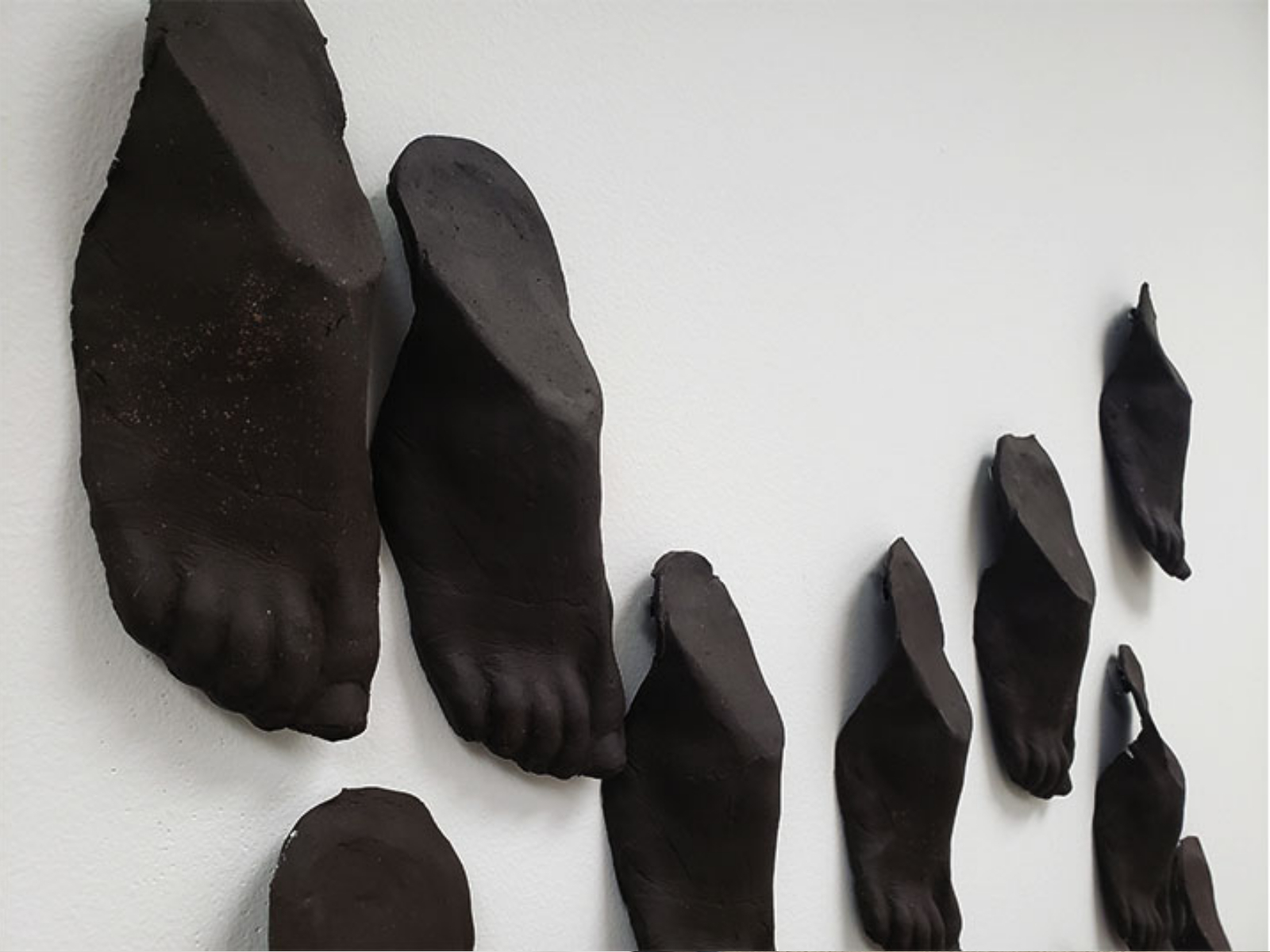 Nyasha Madamombe, Best Foot Forward, 2020, ceramics installation, 84" x 45" x 2"