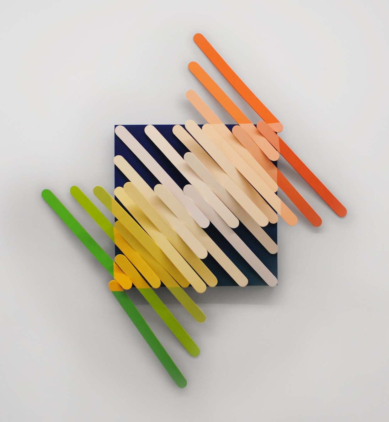 Kayla Rumpp, Teeter, acrylic, foam board, on wood, enlarged popsicle sticks ascending towards the center, 40" x 40" 6", 2019