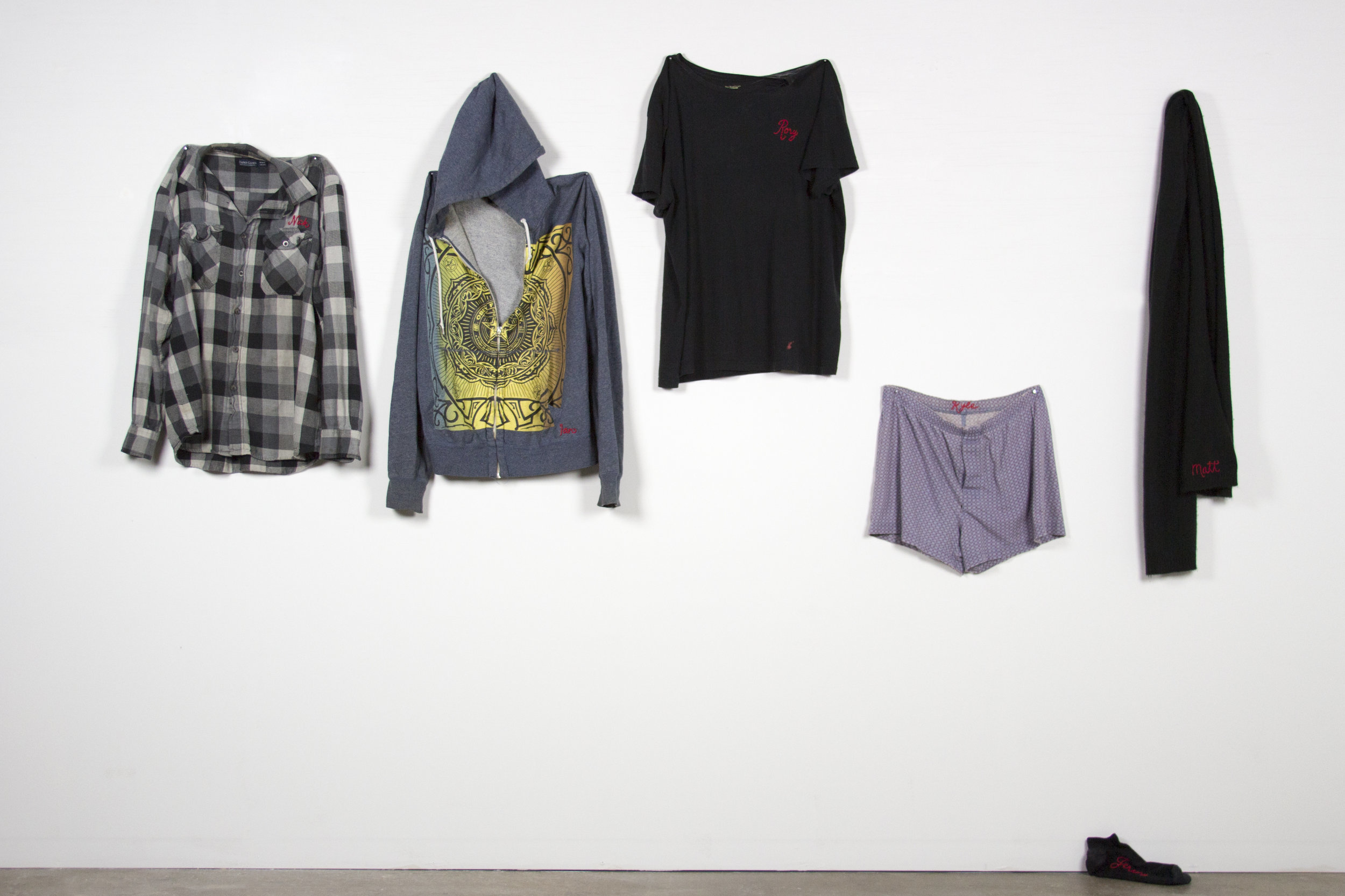 Erica Mendoza, #WasteHerTime2013to2017, hand-embroidered ex-boyfriend clothing, installation dimensions vary, 2017
