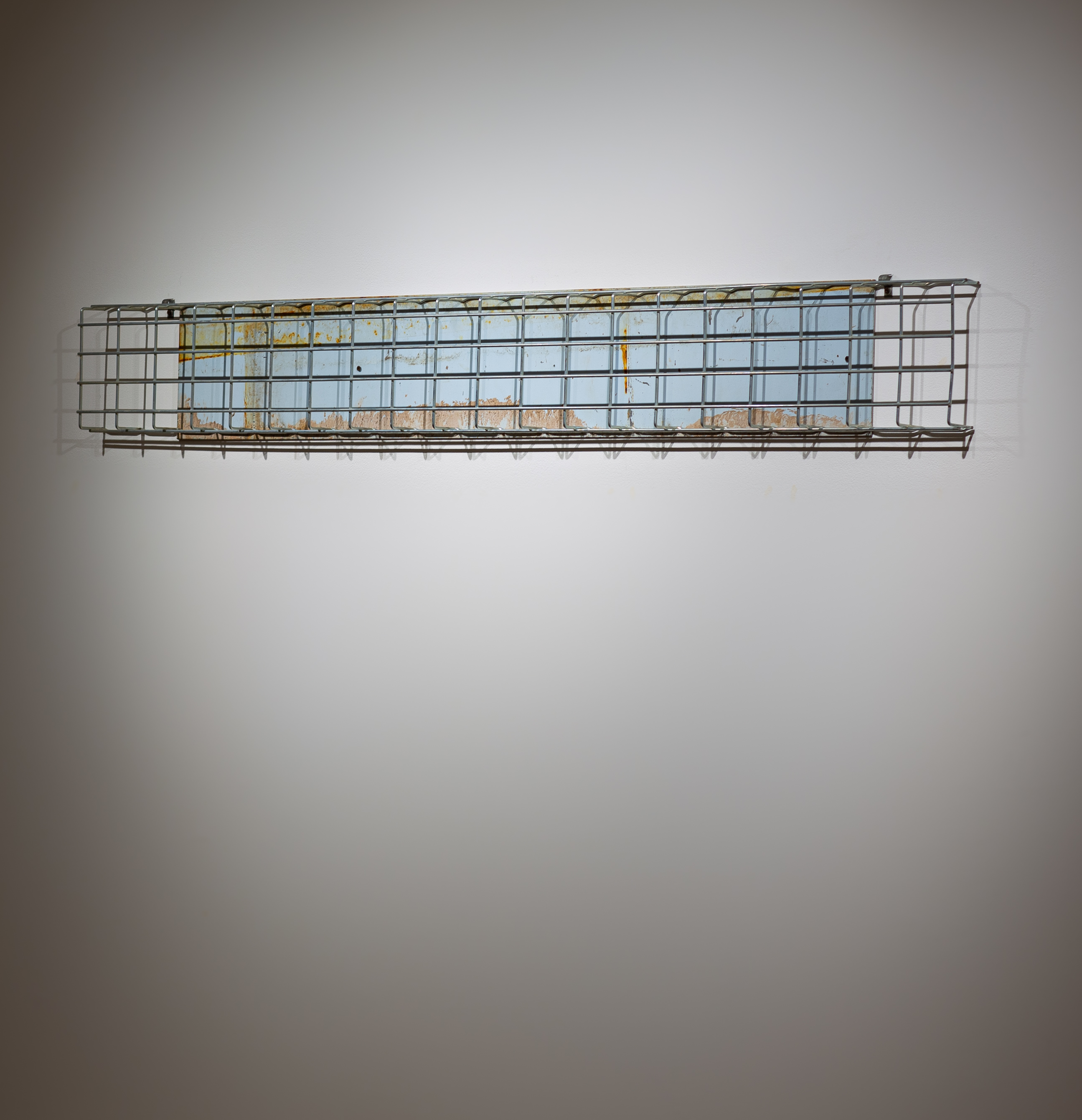 Tracy Treadwell, Sweet Baby Blue (Holy Terror), 2021 (9” x 79” x 3”) painted aluminum, steel grate