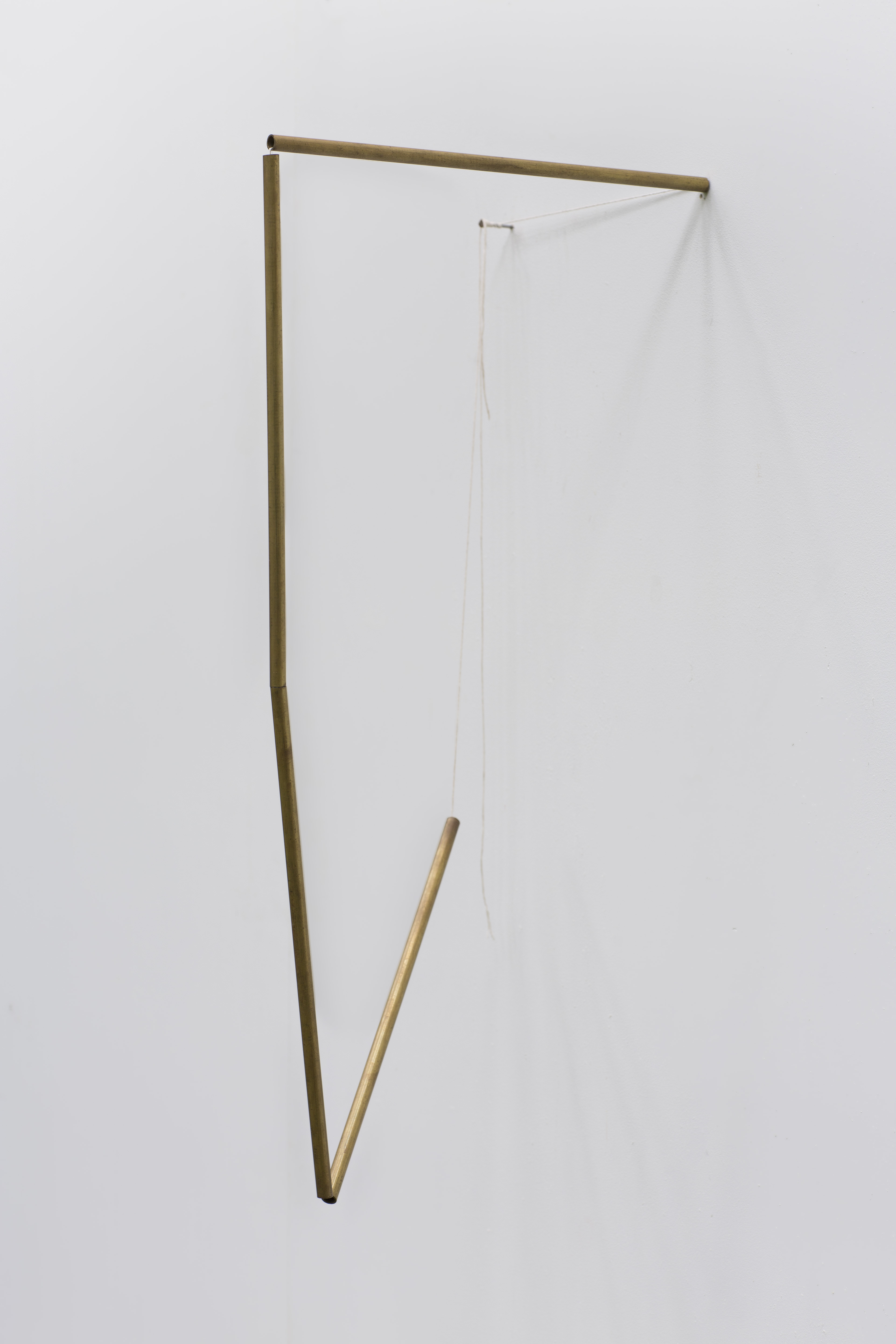 Tracy Treadwell, When Was My Mother, My Mother Again, 2020 (24” x 9” x 12”) brass stem, cotton thread, nail