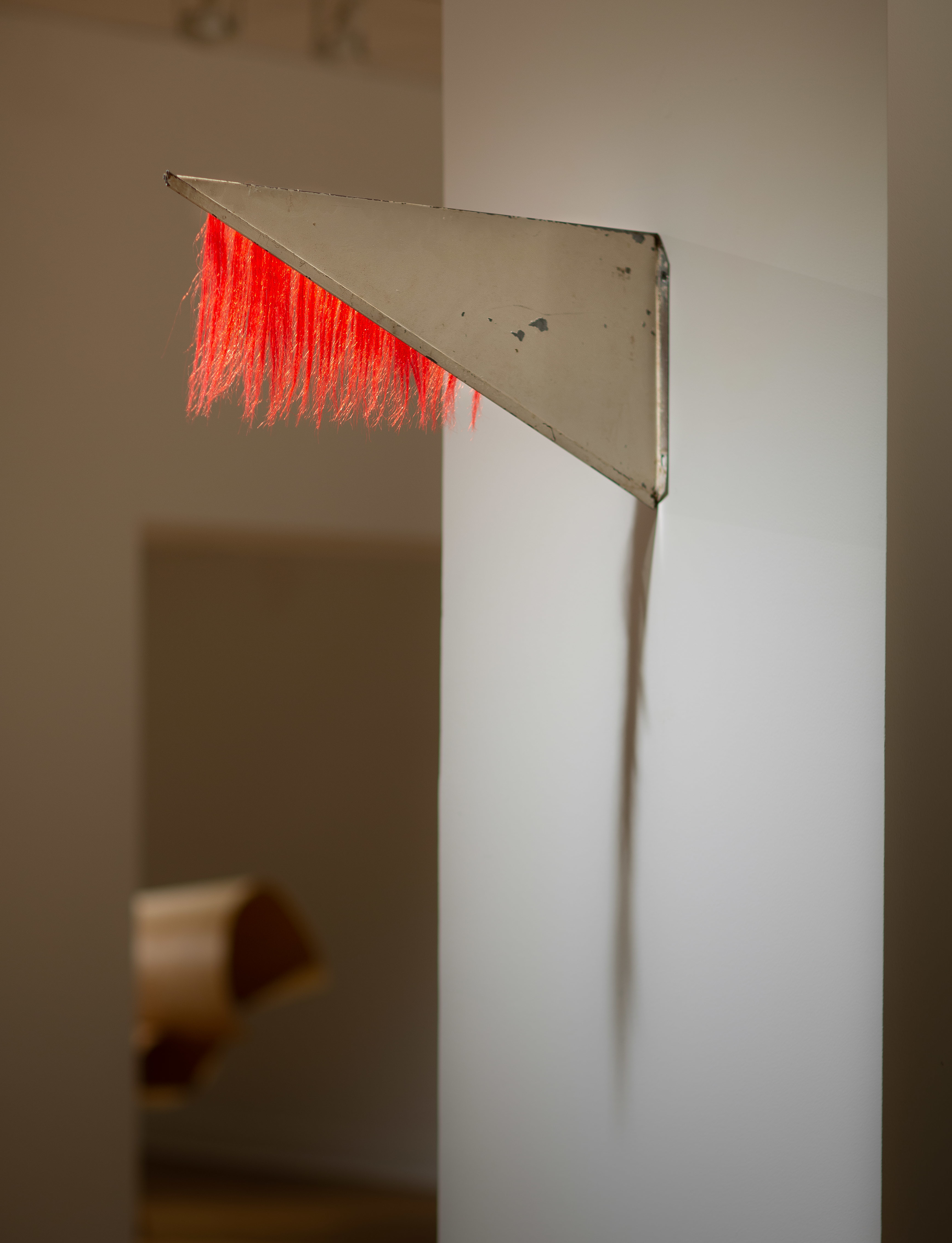 Tracy Treadwell, Untitled (Revolving Flag), 2020 (8” x 18” x 1”) steel sign, synthetic hair