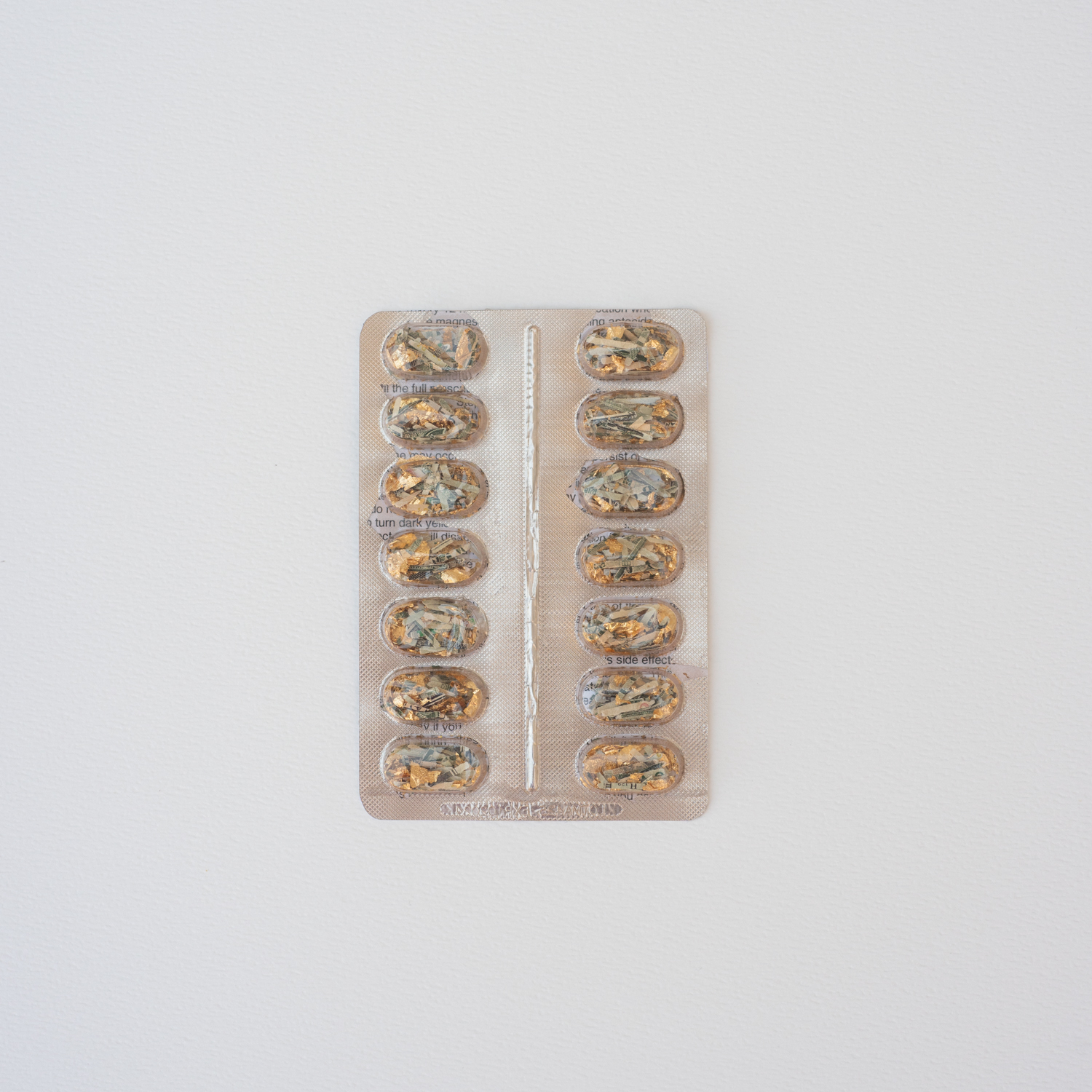 Jocelyn Mathewes, Spent (Mark 5:26), 2023, discarded pill pack, shredded money, gold leaf, prescription sheets, in 8” x 10” shadow box Jocelyn Mathewes, Spent (Mark 5:26), 2023, discarded pill pack, shredded money, gold leaf, prescription sheets, in 8” x 10” shadow box
