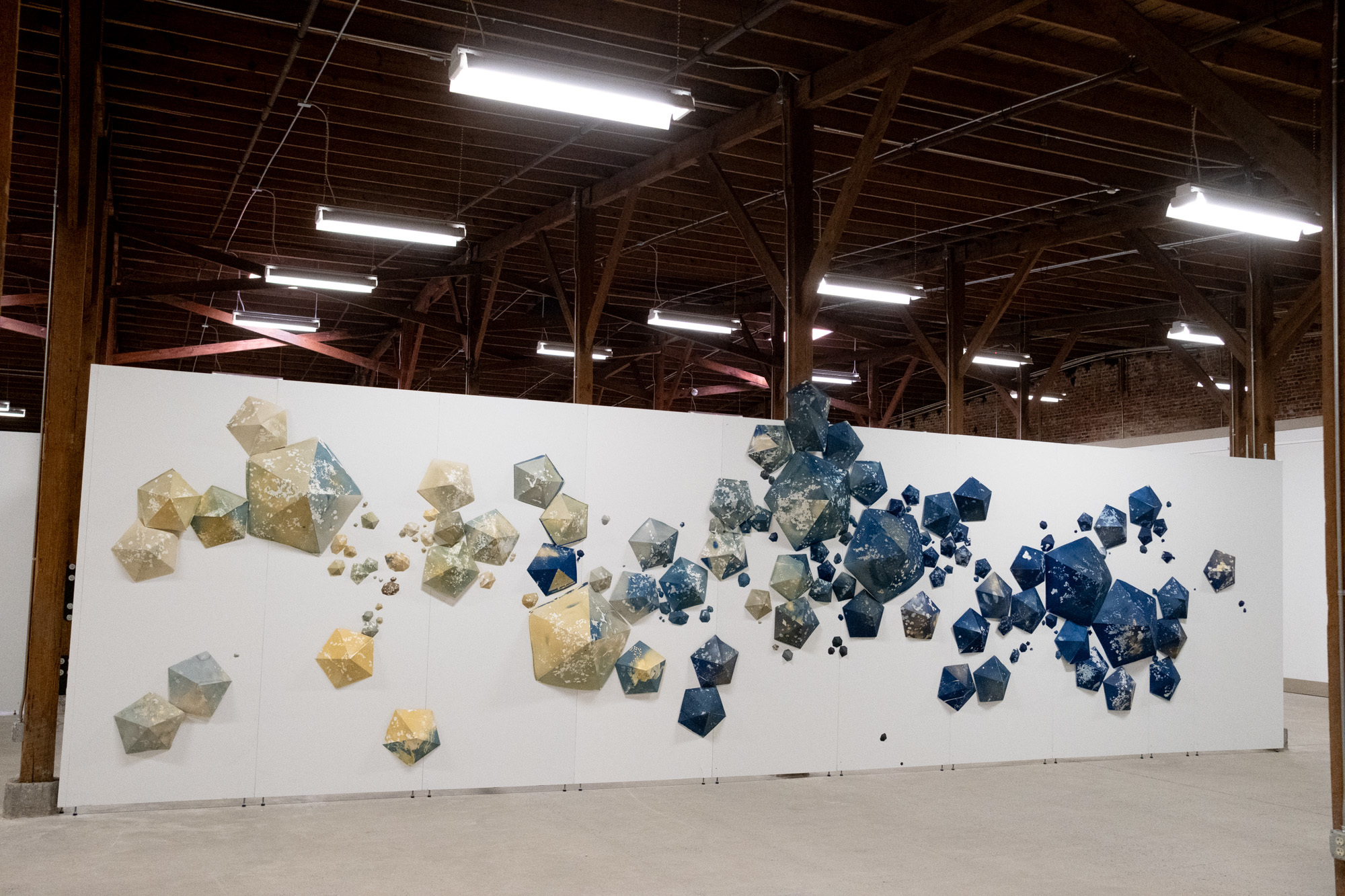 Jocelyn Mathewes, Para(site)dise, 2023 - ongoing, paper constructions formed from cyanotype prints of weeds pulled out of my garden - includes polyhedral shapes, dimensions variable, from 16' w x 8' h to 30' w x 8' h Jocelyn Mathewes, Para(site)dise, 2023 - ongoing, paper constructions formed from cyanotype prints of weeds pulled out of my garden - includes polyhedral shapes, dimensions variable, from 16' w x 8' h to 30' w x 8' h