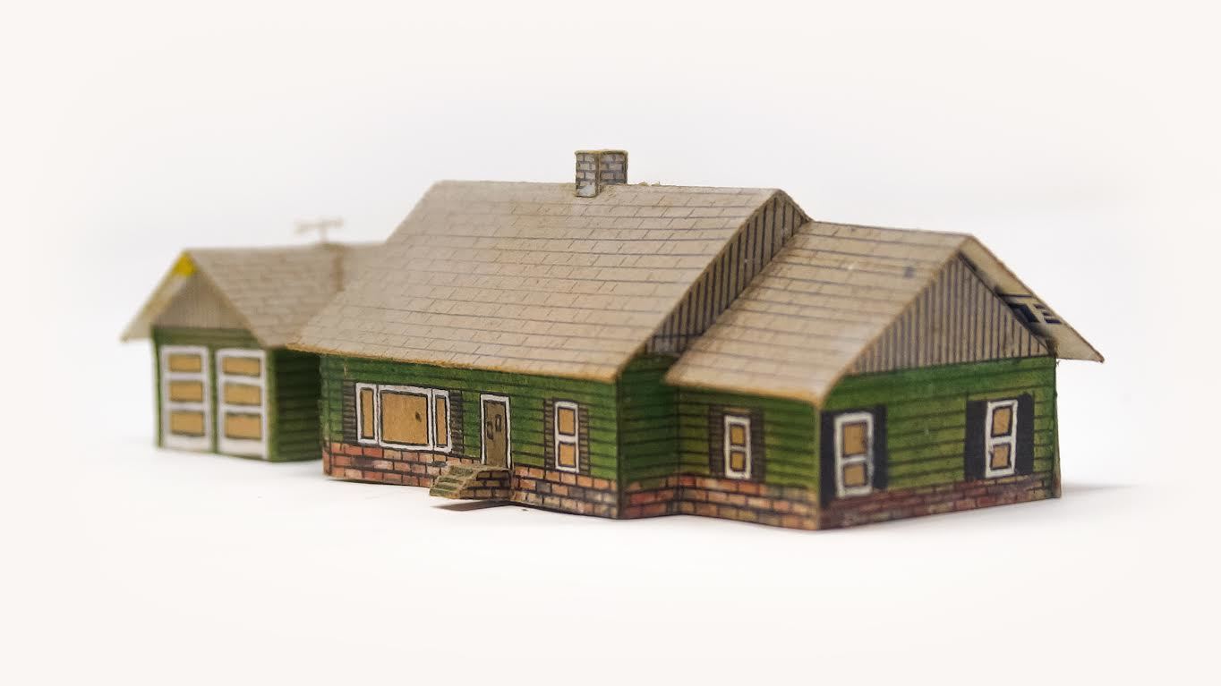 Don Royce Miller, date unknown, a model he made of his house made out of a comet model airplane box