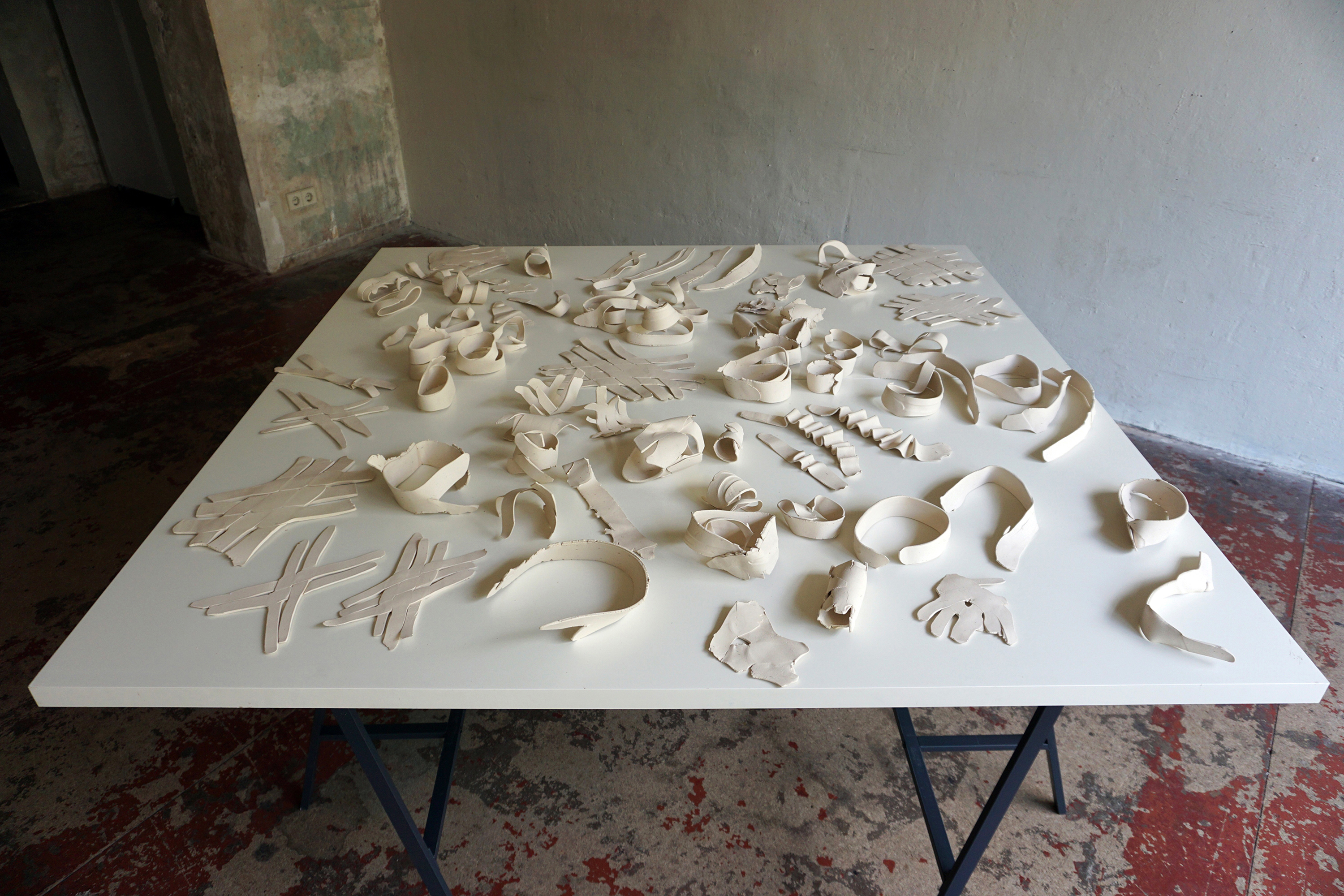 Jennifer Danos, On the Ideology of Fieldwork, 2016, Installation and detail views, Fired, unglazed white clay on tables, Dimensions variable, from Fieldwork: Berlin Summer Salon